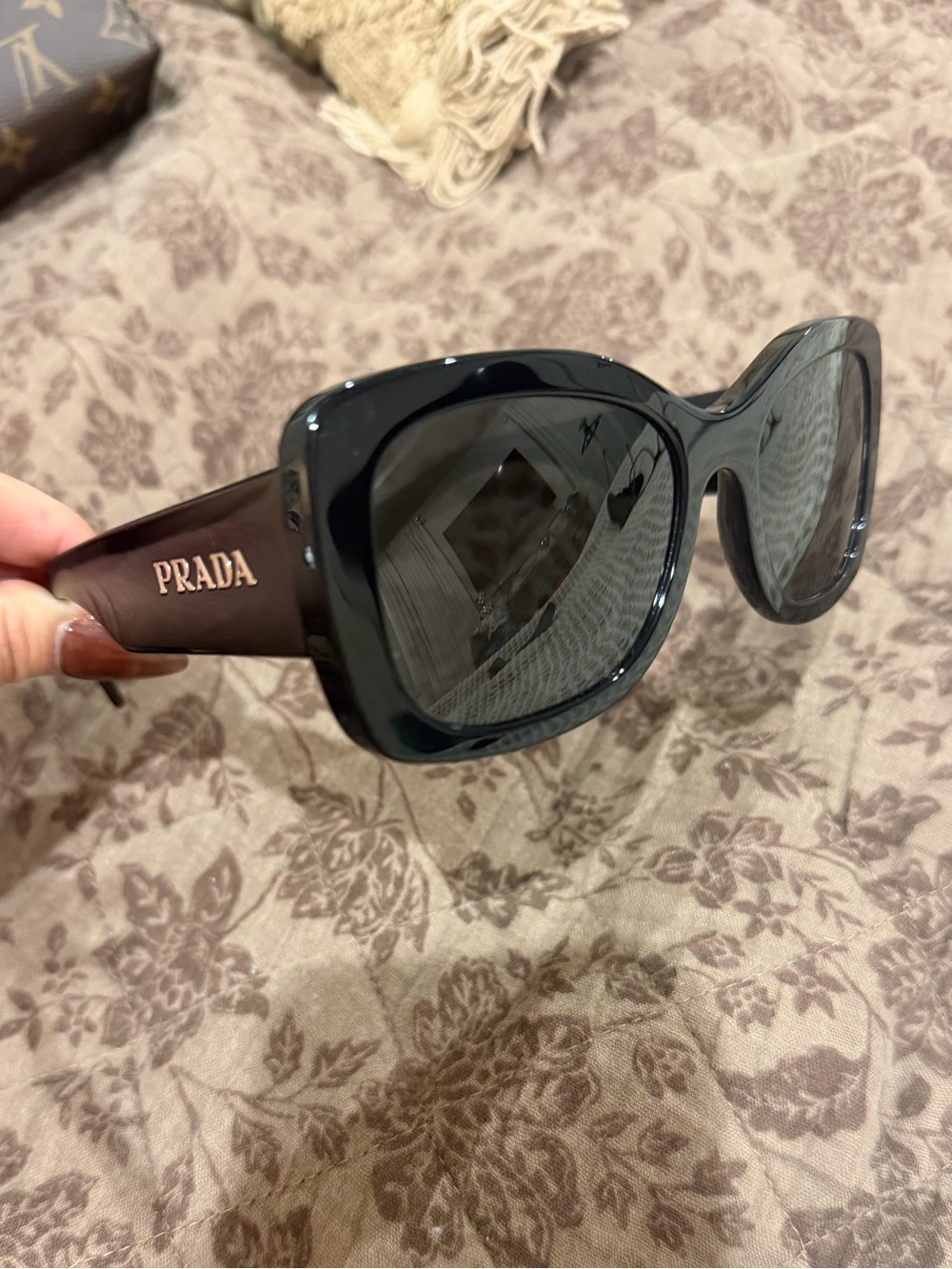 Prada Womenβs Square Sunglasses in Black with Brown Temples